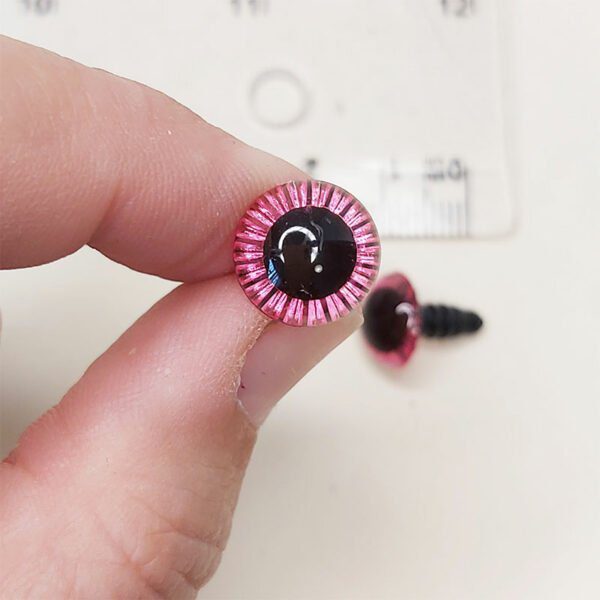 ojo de seguridad con destellos brollantes color rosa de 11mm